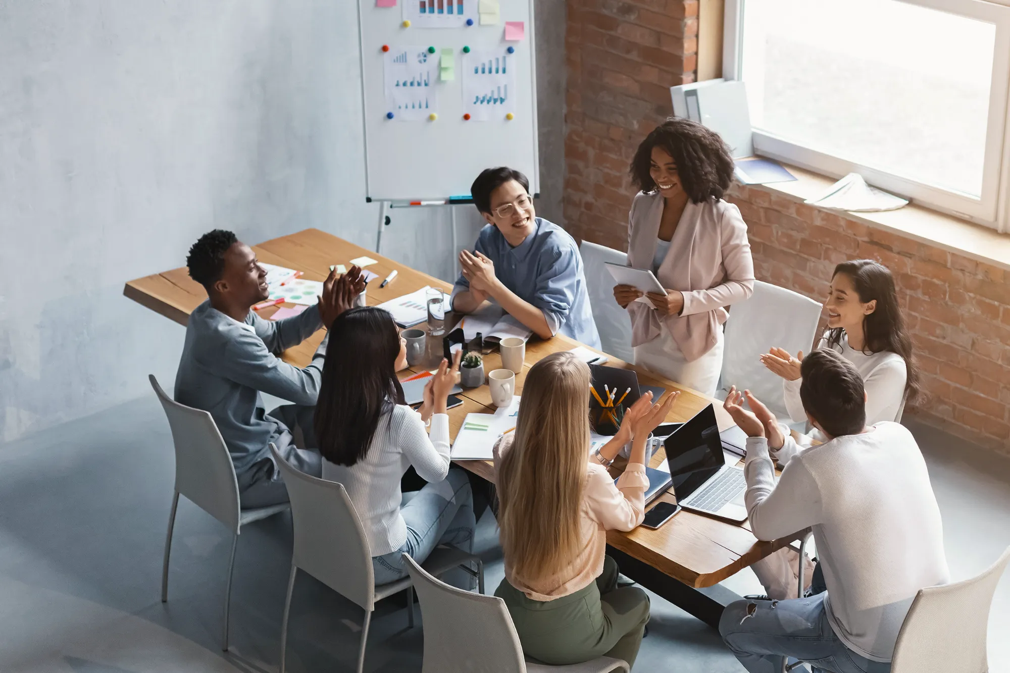 A team of young professionals at a conference table.