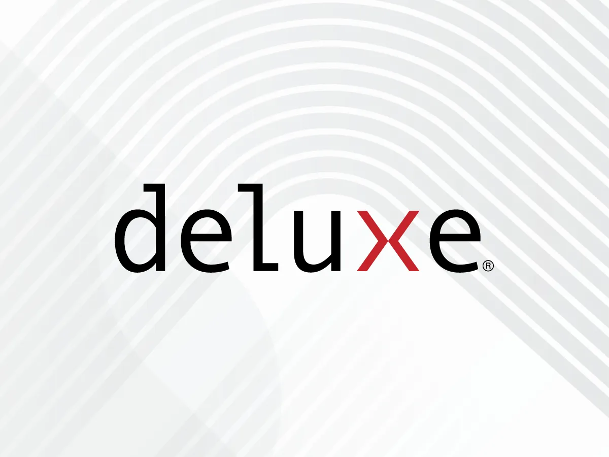 The Deluxe logo, featuring the word "deluxe" in black lowercase letters with a red 'x'. The background is white with subtle gray curved lines.